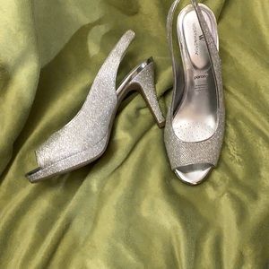 Rhinestone studded open toe sling back heels.